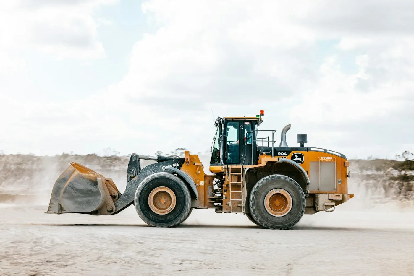 Wheel loader moving across an open site